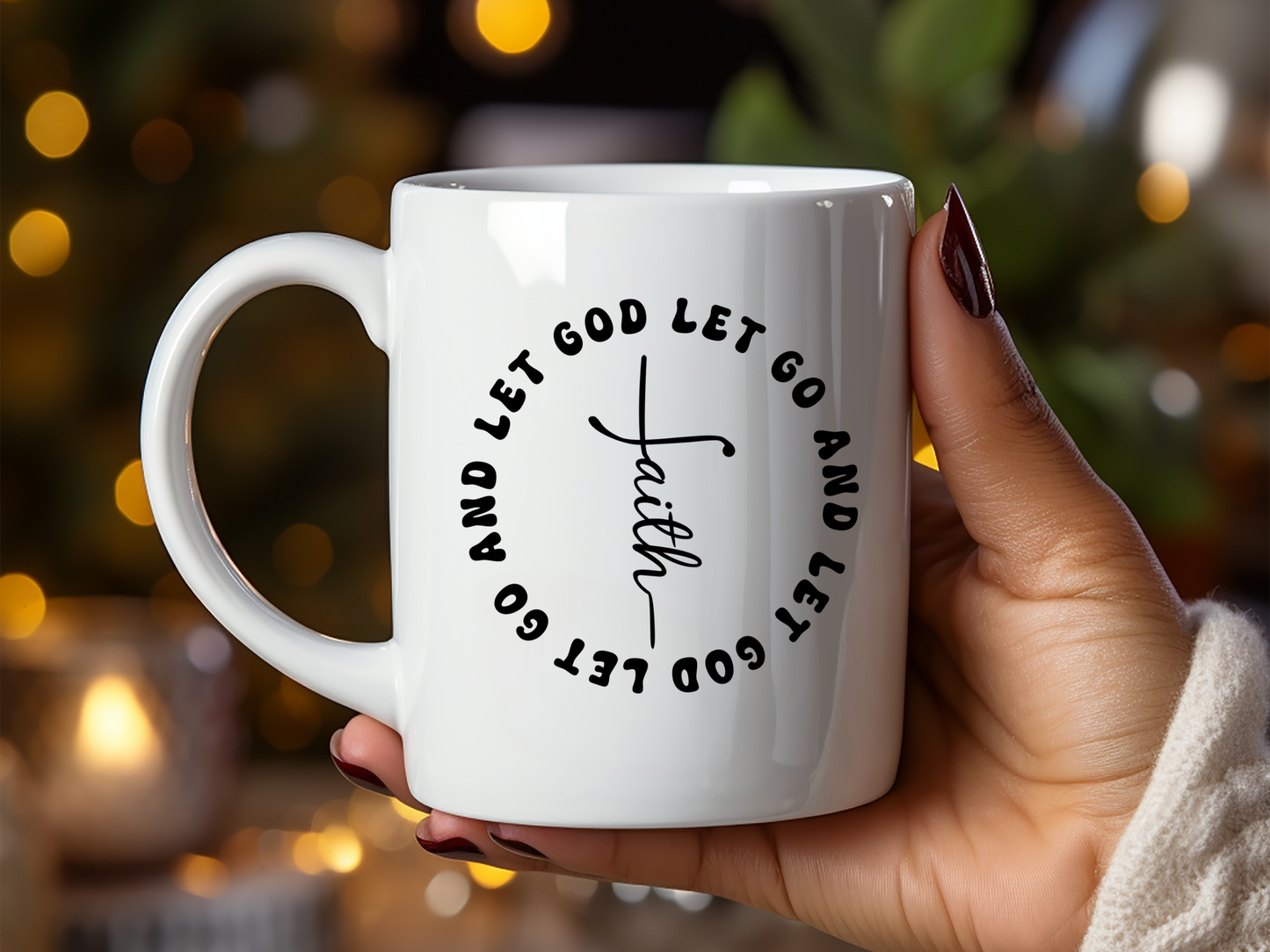 A person holding a white ceramic mug with the text 'Let Go Let God' printed on it.
